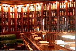 A collection of antique bottles line the walls